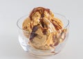 Ice cream in glass bowl - Caramel and vanilla ice cream drizzled