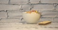 Ice cream in a glass bowl with decorative topping and waffles, lie on a wooden table. Close-up Royalty Free Stock Photo