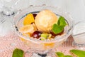 Ice cream with grapes and bananas in a glass bowl Royalty Free Stock Photo