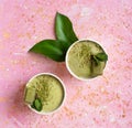 Ice cream with green tea on a pink background. Mint leaves Royalty Free Stock Photo