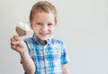 Ice cream and happy baby. Happy boy with ice cream on a white background. Good mood of the child and cold dessert