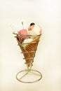 Ice Cream Holders. Strawberry, mint, vanilla with sour cherry ice cream in large waffle cone in holder, spoon. Royalty Free Stock Photo