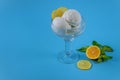 Ice cream with lemon on blue background Royalty Free Stock Photo