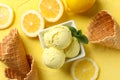 Ice cream, lemon and waffles on background, top view Royalty Free Stock Photo