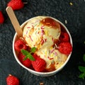 Ice Cream in paper cup with raspberry fruit and caramel sauce Royalty Free Stock Photo