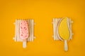 Ice cream, pink and yellow in the shape of a very delicious mango on an orange background Royalty Free Stock Photo