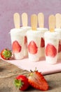 Strawberry yogurt ice cream popsicles. Healthy dessert. Homemade product. Summer background Royalty Free Stock Photo