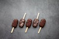 Ice cream popsicle cake on a stick on dark grey background. Sweets for party. Concept food, baking, holidays