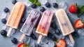 ice cream popsicles with fruits and berries and ice cubes on a table Royalty Free Stock Photo