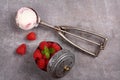 Ice cream scoop with berry ice cream and raspberry on old wooden background Royalty Free Stock Photo