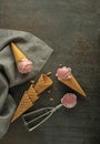 Ice cream scooped in to waffle cones with a silver utensil Royalty Free Stock Photo