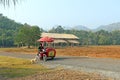 Ice cream seller and dog on a country road in Kanchanaburi province in the North of the Kingdom of Thailand Royalty Free Stock Photo