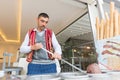 An ice cream seller, dressed in traditional Turkish costume