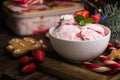 Ice cream served in a glass bowl. Displayed with candy canes on wooden rustic table. Sparkling Christmas tree lights background