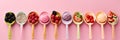 Ice Cream, Set of ice cream scoops of different colors and flavours with berries, nuts and fruits decoration on pink background. Royalty Free Stock Photo