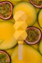 Ice cream on sliced tropical fruits background. popsicle. molecular kitchen. ice cream on a stick on mango and pashion fruit Royalty Free Stock Photo