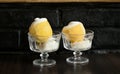 Ice cream sorbet in lemon and glass on dark background Royalty Free Stock Photo
