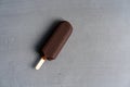 Ice cream stick on dark background covered chocolate sticks frozen Popsicle and Lolly sweet dessert Flat lay