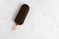 Ice cream stick on dark white background covered chocolate sticks frozen Popsicle and Lolly sweet dessert Flat lay