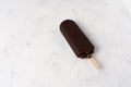 Ice cream stick on dark white background covered chocolate sticks frozen Popsicle and Lolly sweet dessert Flat lay