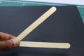Ice cream sticks held in hand which will be use to make various creative crafts