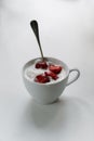 Ice cream with strawberries in a cup on the n white table Royalty Free Stock Photo