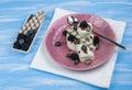 Ice cream with strawberries, mint and ice on dark metal tray. Overhead shot Royalty Free Stock Photo