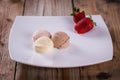 Ice cream with strawberries on a plate