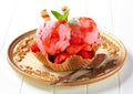 Ice cream with strawberries in wafer bowl Royalty Free Stock Photo