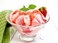 Ice cream strawberry with syrup in glass on light board Royalty Free Stock Photo