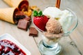 Ice cream sundae, chocolate, walnuts, jam and strawberry Royalty Free Stock Photo