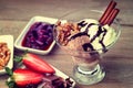 Ice cream sundae, chocolate, walnuts, sliced strawberry and jam Royalty Free Stock Photo