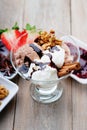 Ice cream sundae, chocolate, walnuts, sliced strawberry and jam Royalty Free Stock Photo