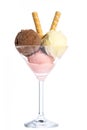 Ice cream: Three scoops of ice cream in red, yellow and brown in a martini glass