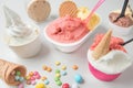 ice cream tubs in various fruit flavours with biscuits