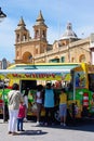 Ice Cream Van and church, Marsaxlokk. Royalty Free Stock Photo