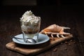 Ice cream with coffee, Affogato al Caffe Frappe with shell on the dark table.