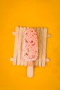 ice cream, very delicious pink on an orange background Royalty Free Stock Photo