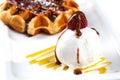 Ice cream and Viennese waffles in a white plate on an isolated white background closeup