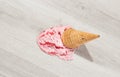 Ice cream in a waffle cone fell on floor Royalty Free Stock Photo