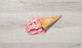 Ice cream in a waffle cone fell on floor Royalty Free Stock Photo