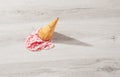Ice cream in a waffle cone fell on floor Royalty Free Stock Photo