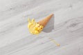 Ice cream in a waffle cone fell on floor Royalty Free Stock Photo