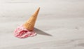 Ice cream in a waffle cone fell on floor Royalty Free Stock Photo