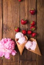 Ice cream in a waffle cone on a wooden background. Strawberry ice cream Royalty Free Stock Photo