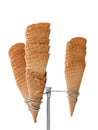 Ice cream waffle cones on dispenser isolated on white Royalty Free Stock Photo