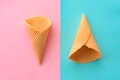 Ice cream waffle cones on pastel pink and blue background Royalty Free Stock Photo