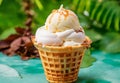 Ice cream in a waffle cup. Ice cream sundae on a blue background. Vanilla popsicles. Ice cream cone close up. Royalty Free Stock Photo