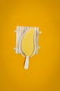 ice cream, yellow in the shape of a very delicious mango on an orange background Royalty Free Stock Photo