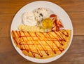 Ice creame crape with strawberry sauce and banana Royalty Free Stock Photo
